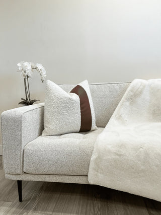 off white boucle and leather couch