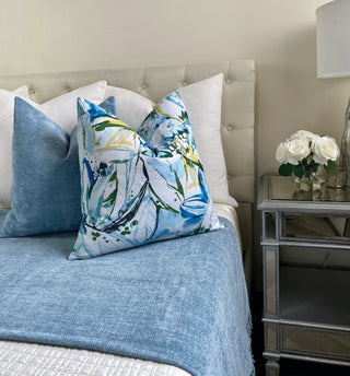shc light blue and floral blue on bed