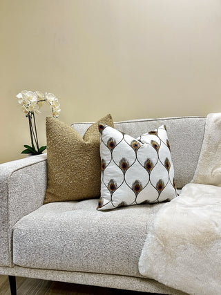 tan boucle couch peacok