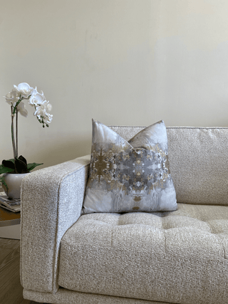 gray gold medallion on couch